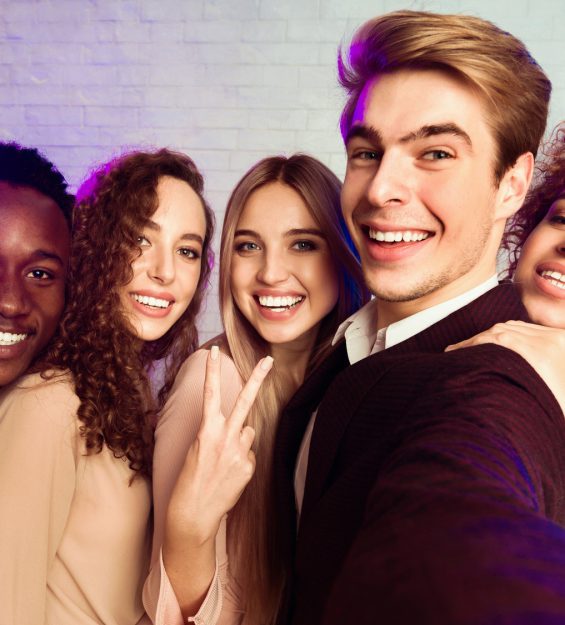 Millennial People Making Selfie Having Fun On Corporate Party Indoors